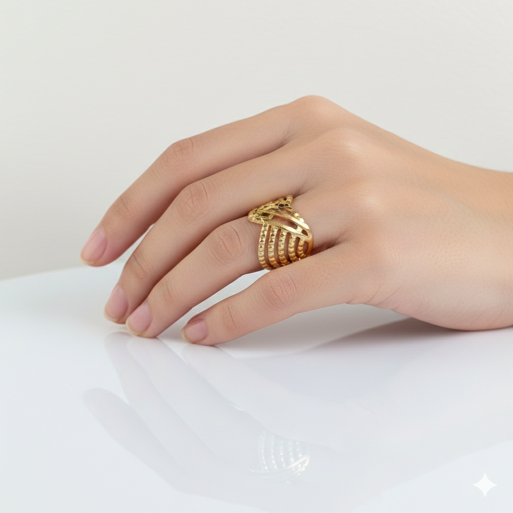 Hand wearing a gold ring on a white background